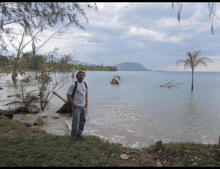Geologist Rich Koehler stands on a shoreline in Haiti. Landslides during the magnitude 7.0 earthquake in January 2010 transported a few trees out to sea. Photo by Paul Mann.