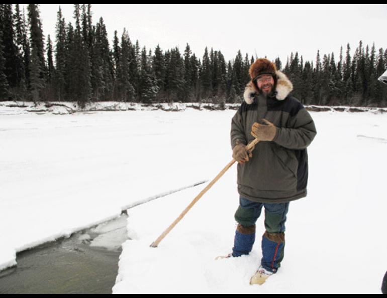  UAF ecologist Knut Kielland checks out a mysterious hole in the ice of the Tanana River. Photo by Ned Rozell 