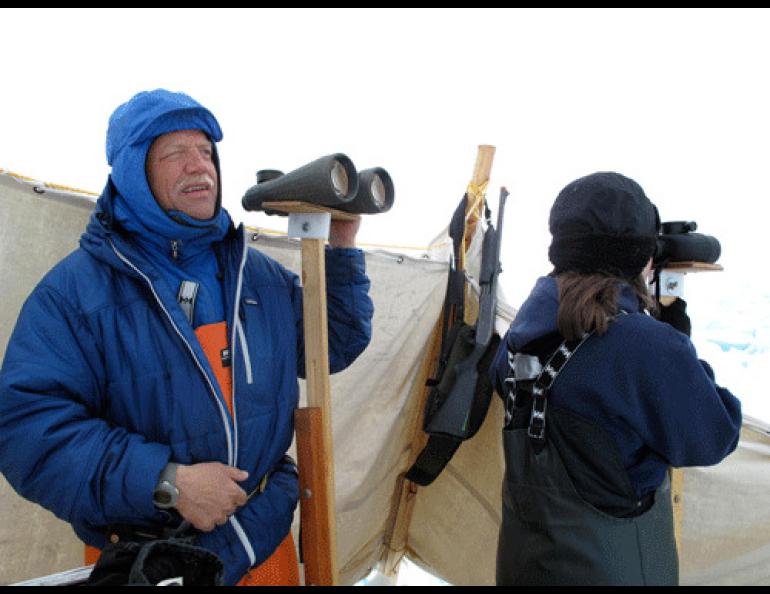  Craig George, left, and Leslie Pierce look for bowhead whales north of Barrow. 