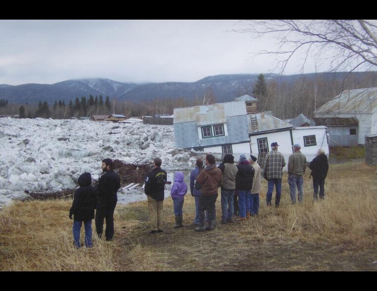 In this photo taken in May, 2009, townspeople of Eagle, Alaska, look at the destruction caused by an ice-jam flood of the Yukon River. Photo from Eagle Trading Post collection.