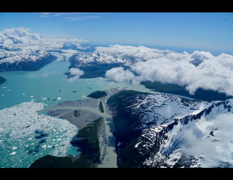 The Alsek River is the straight, tan waterway with a major branch that turns left into Alsek Lake. As the Grand Plateau Glacier — near top left of the photo — recedes, scientists think the Alsek River will flow that way to the sea. Currently, the Alsek River hangs a sharp right to reach Dry Bay. CL