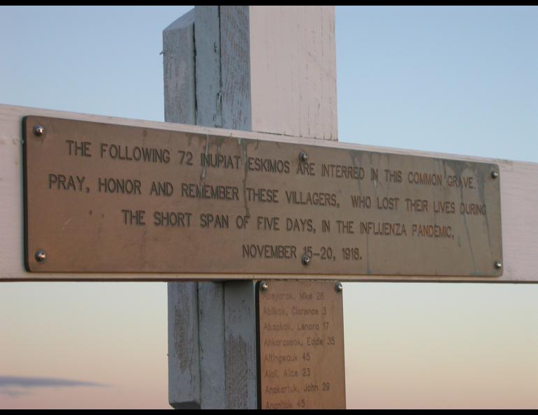 Detail from a cross that marks the grave of 72 people, who died from the Spanish flu in Brevig Mission in 1918. Photo by Ned Rozell.