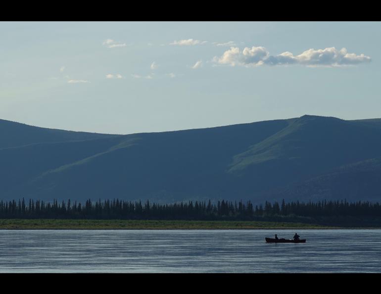 Cora the dog and Ned Rozell float down the Yukon River just upstream from Circle. Photo by Skip Ambrose.