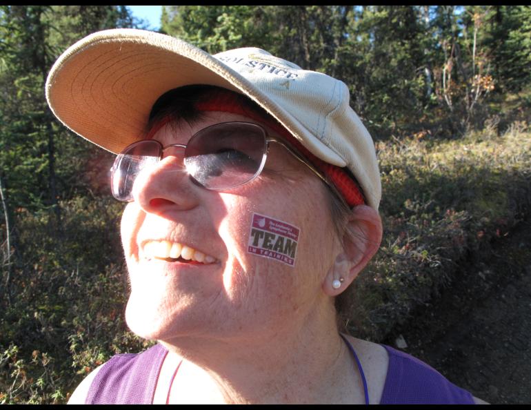 LJ Evans shows her temporary tattoo for Team in Training, a group that raised money for cancer research in exchange for training to run the race, during the 2009 Equinox Marathon. Photo by Ned Rozell.