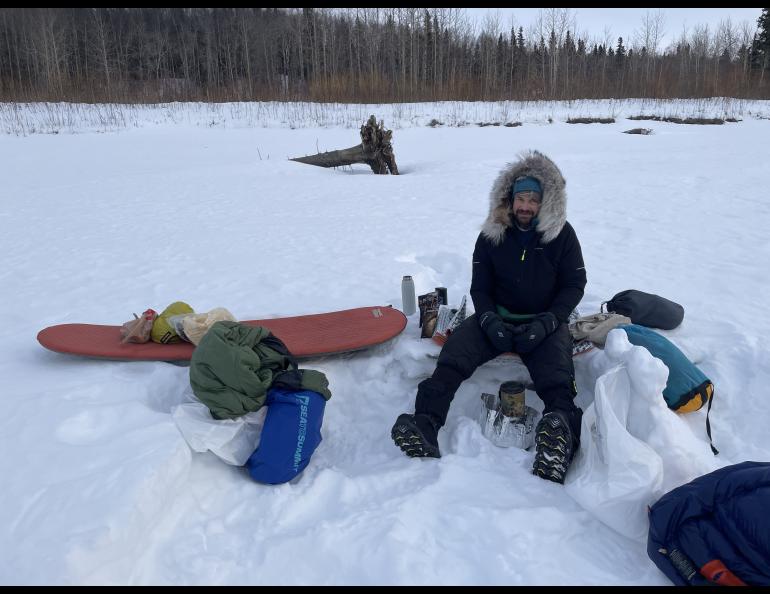 Forest Wagner melts snow to hydrate meals at a campsite on the Yukon River between the villages of Ruby and Tanana. Photo by Ned Rozell.