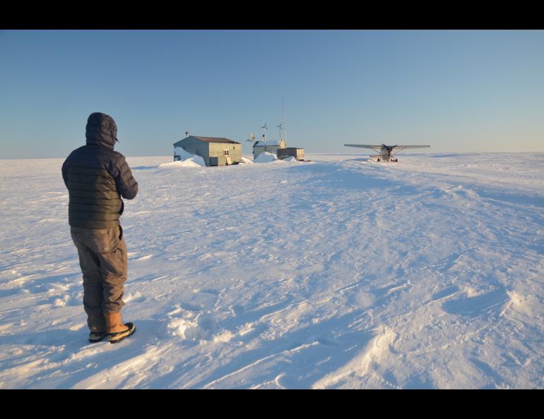 Jim Webster and his plane near a cabin on Teshekpuk Lake in northern Alaska. Photo by Ben Jones.