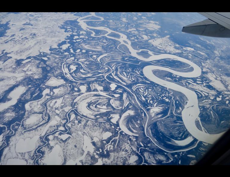 The Yukon River, seen here as a wide white band, is freezing later in fall and breaking up earlier in spring than it was a few decades ago. By Ned Rozell.