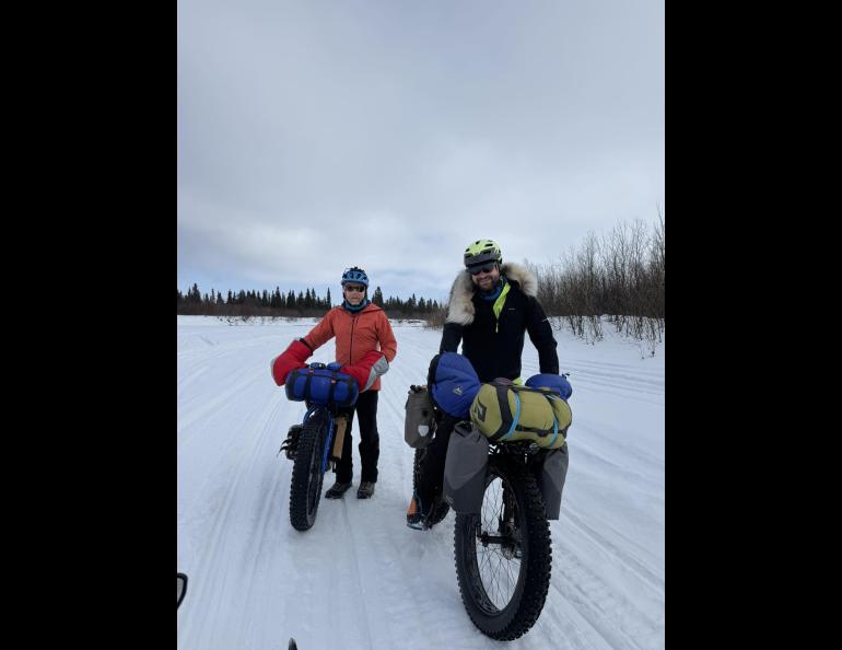 Ned Rozell, left, and Forest Wagner of Fairbanks push their bikes on the Unalakleet River just outside the village of the same name. Photo by Warren Katchatag.