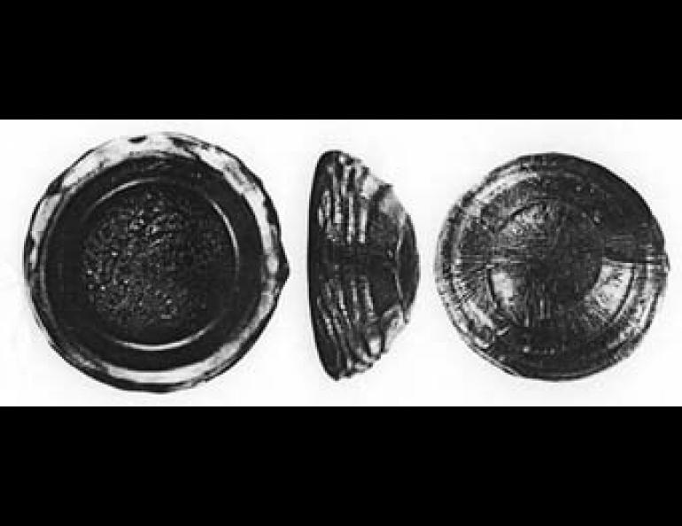 Mug shot (front, back and side) of Australian tektite. Direction of air flow was into the large, convex face.