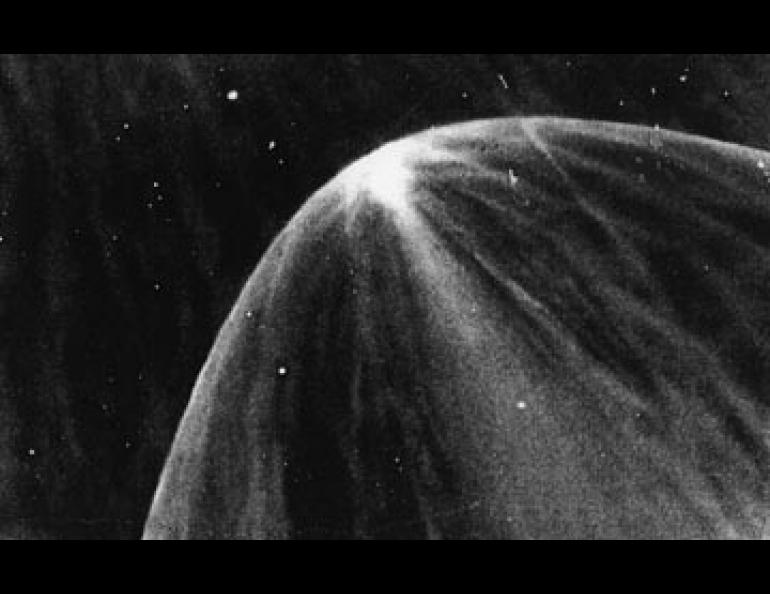 A shock wave of ionized gas arcs around a large star in the Orion Nebula. This is very similar to the manner in which the earth's magnetic field deflects particles in the solar wind.