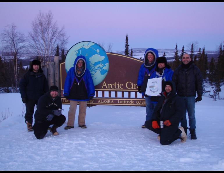 From left, Ryan West, Shawn Freitas, John Whittington, Doug Morrow, Bernie Tao, Darrin Marshall, and Andy Soria pose at the Arctic Circle pull-out on the Dalton Highway, where they camped in March 2009 to test the cold-weather performance of “Permaflo Biodiesel.” Photo courtesy Darrin Marshall.