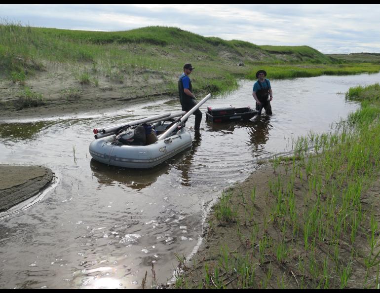 From left, Reyce Bogardus and Chris Maio in a surge channel on Cape Espenberg, preparing to travel inland to core a lake. Photo by Nancy Bigelow.