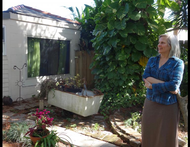 Deb Long in the courtyard outside her New Orleans home. 