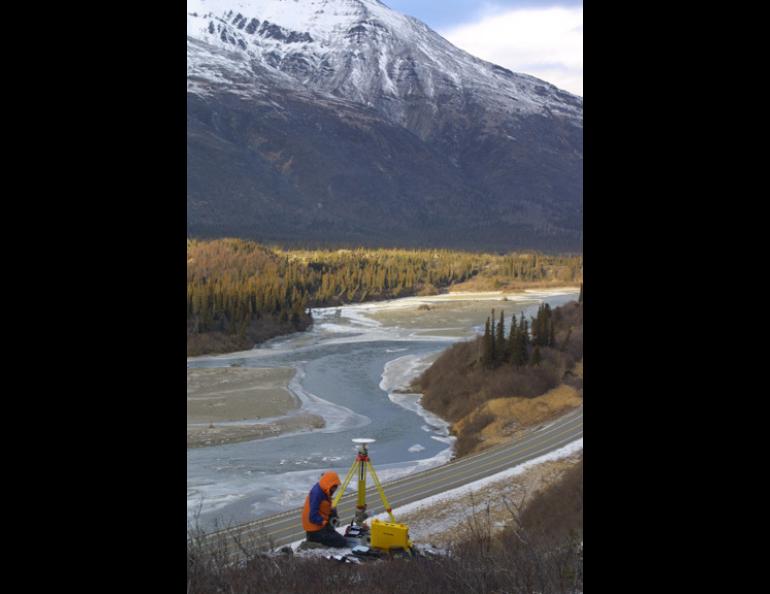 Lissy Hennig, a German student working for the University of Alaska¹s Geophysical Institute, sets up a GPS receiver station on the flank of Panorama Mountain north of Cantwell along the Parks Highway. Ground movement along the nearby Denali Fault has increased dramatically since the 7.9 earthquake of Nov. 3, 2002. Geophysical Institute photo.