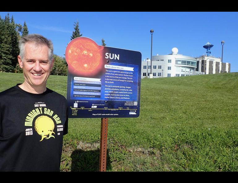 Space physics expert Peter Delamere at the start of the new UAF Planet Walk in Fairbanks. Photo by Ned Rozell.