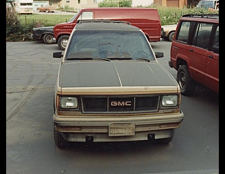 A layer of gray ash from Mount Spurr volcano’s Aug. 18, 1992, eruption coats the hood, windshield and roof of Julie Stricker’s GMC vehicle in Anchorage. The eruption blanketed the city in about one-eighth inch of ash.