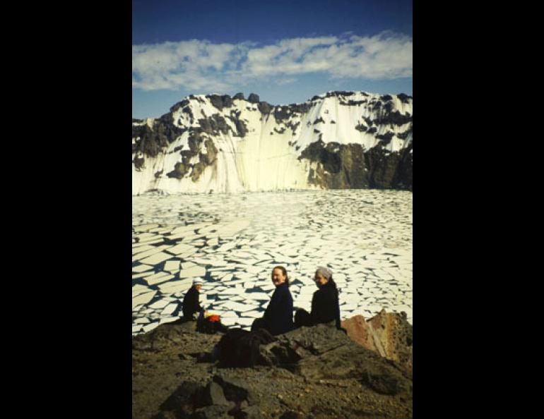  (Katmai caldera) At the summit of Mount Katmai, three hikers sit on the rim of a crater lake that was a mountaintop before 1912. From left are Nathan Eichelberger, Amanda Austin and Diana Roman, who visited Mount Katmai on a field trip in June, 2001. 