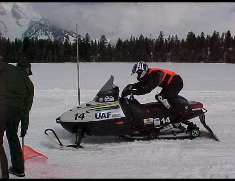 Edwin Dale Hahn takes off from the starting line in an acceleration and noise test during the Clean Snowmobile Challenge, held in late March, 2001 outside Yellowstone National Park. The UAF team of Hahn and Jason Rohwer finished with the second-quietest machine in the collegiate competition. -Jason Rohwer photo.