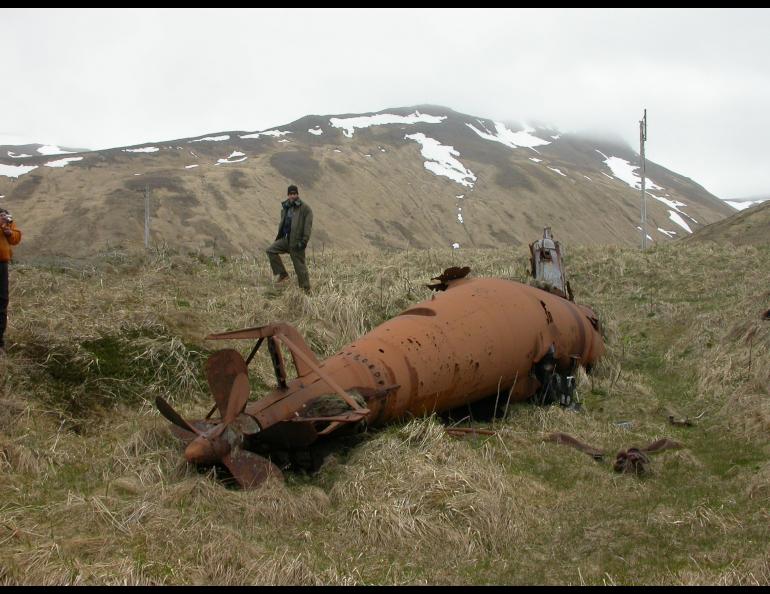 Biologist Jeff Williams near a midget submarine on Kiska Island in the far west Aleutians in 2004. Photo by Ned Rozell.