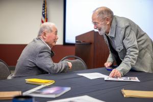 Syun-Ichi Akasofu (left) greets Chuck Deehr at the 2026 GI reunion. Photo by Eric Marshall