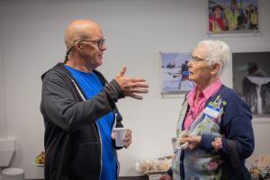 Mitch Robinson (left) in discussion with Judy Triplehorn at the 2026 GI reunion. Photo by Eric Marshall