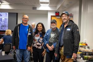 Mitch Robinson (left), Anupma Prakash, Steve Estes and Dale Pomraning pose for a photo during the 2026 GI reunion. Photo by Eric Marshall