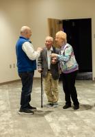 Roger Smith (left) chats with Syun-Ichi Akasofu and Jeanette Moore while the group is at the Walt and Marita Babula Planetarium during the 2026 GI reunion. Photo by Tucker Forbes