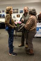 Mary Farrell chats with Clif and Jeanette Moore at the 2026 GI reunion. Photo by Tucker Forbes