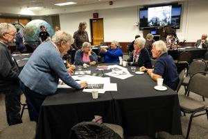 Participants at the 2026 GI reunion helped identify photos for the Communications group. Photo by Tucker Forbes