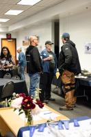 Mitch Robinson (left), Steve Estes and Dale Pomraning chat at the 2026 GI reunion. Photo by Tucker Forbes
