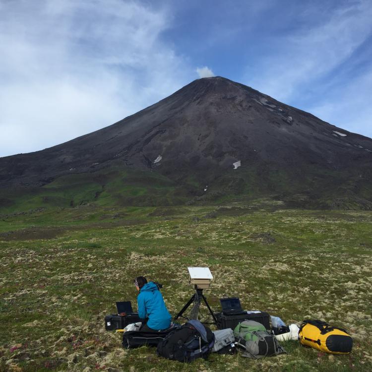 GI researcher Taryn Lopez measures sulfur dioxide emissions from Cleveland Volcano, Alaska. Photo by Cindy Werner.