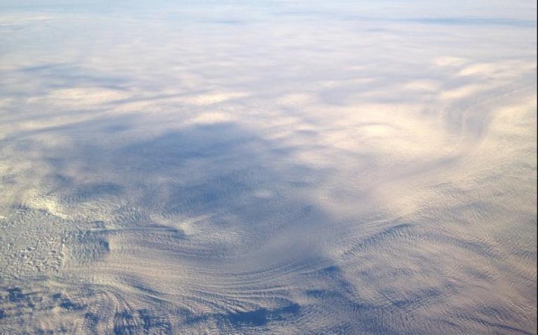 The trunk and terminus of Jakobshavn Isbræ discharge into Ilulissat Fjord. While this outlet glacier and many others have experienced rapid acceleration during the past two decades, most of the ice sheet interior has decelerated during the past 9,000 years. Photo by Timothy Bartholomaus.