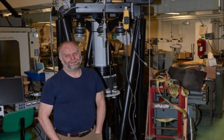 Mark Conde, a space physicist at UAF’s Geophysical Institute, stands next to the scanning Doppler imager. Conde thought up the device, which is heading to Antarctica. Photo courtesy of Mark Conde.