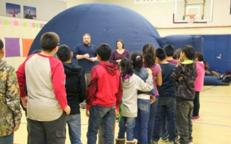 Shungnak students prepare to watch “Kiuguyat: The Northern Lights” in the UAF Geophysical Institute’s portable planetarium dome. Photo by Joan Reynolds.