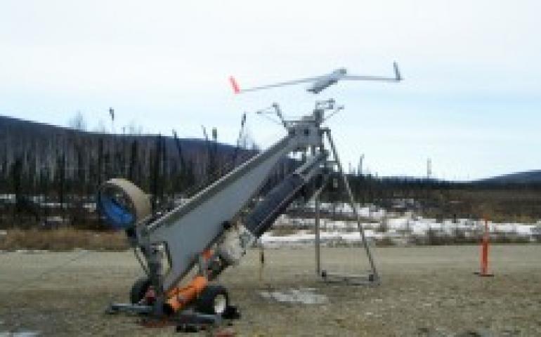 The 40-pound Insitu ScanEagle is catapulted from the launcher to begin a test flight at Poker Flat Research Range in preparation for the upcoming Alaska Shield Exercise. Photo by Amy Hartley.