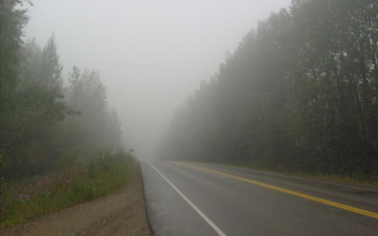 Thick wildfire smoke fills the sky along Chena Hot Springs Road in Fairbanks on Aug. 6, 2009. Photo by Rod Boyce.
