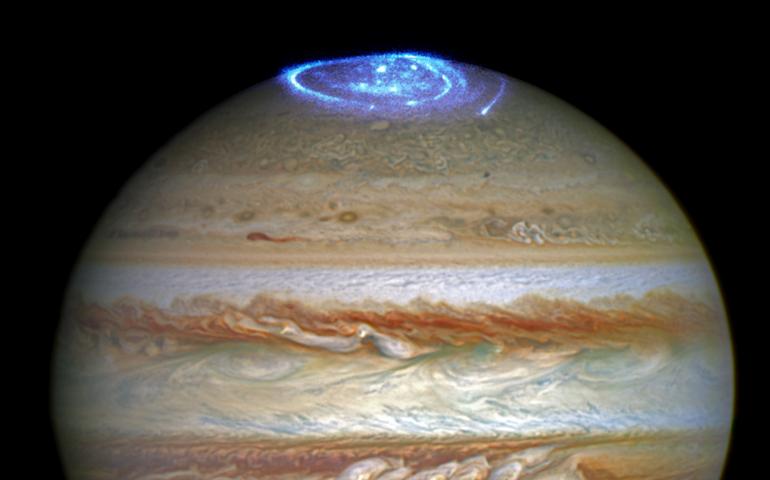 This 2016 image is a composite of two different Hubble observations. The auroras were photographed during a series of Hubble Space Telescope Imaging Spectrograph far-ultraviolet-light observations taking place as NASA's Juno spacecraft approaches and enters into orbit around Jupiter. Credits: NASA