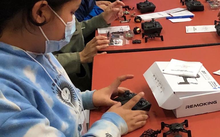 A student at John Fredson School in Venetie, Alaska, works with one of the drone kits provided by the Alaska Satellite Facility through a NASA grant. Photo by Terri Mynatt