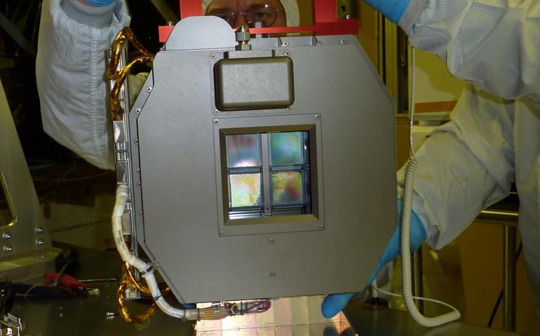 Technicians work with the James Webb Space Telescope NIRSpec microshutter array prior to delivery. Photo by Astrium/NIRSpec