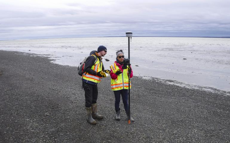 Graduate student Reyce Bogardus and Roberta Glenn survey Kanakanak Beach using real-time kinematic GPS May 28, 2021, in Dillingham, Alaska. UAF/GI photo by Chris Maio.