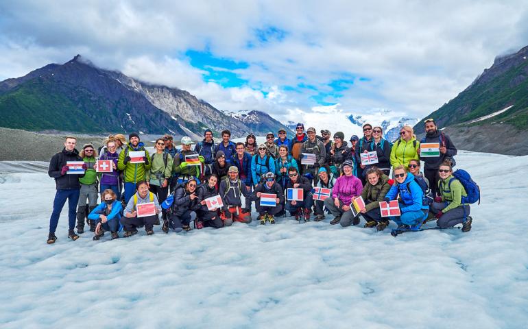 A group photo on Root Glacier of participants in the International Summer School in Glaciology. Photo by Dave Sarbell