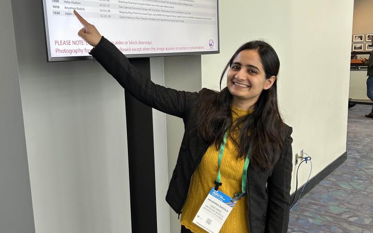 Anushree Badola points to her name on the American Geophysical Union talk schedule. Photo by Rod Boyce