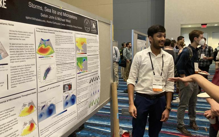 Ph.D. student Sebin John presents his research on observing the impact of ocean storms and sea ice on seismic background noise across Alaska. Photo by Mike West