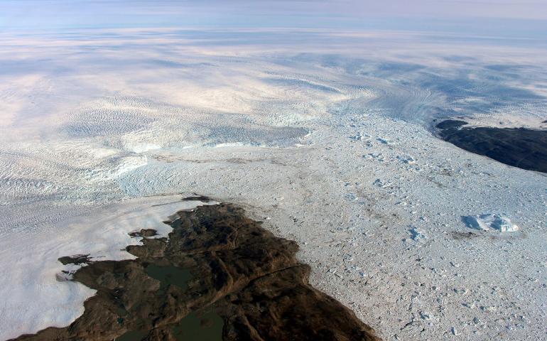 Jakobshavn Glacier calves icebergs into the ocean. Photo by John Sonntag/NASA