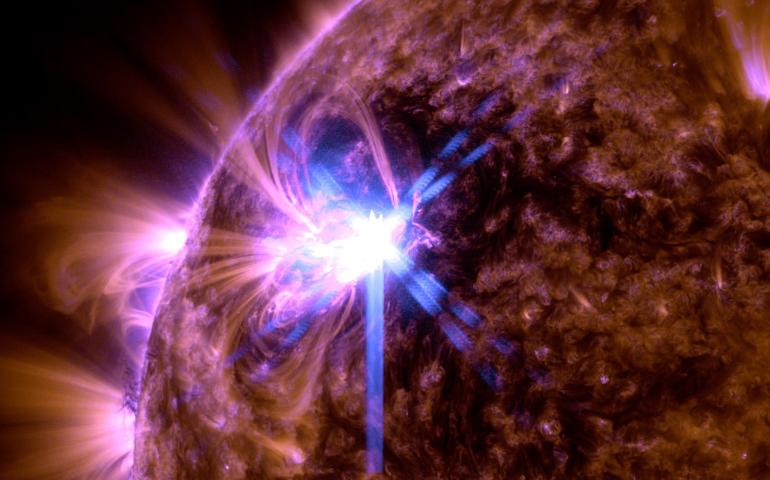 A solar flare flashes in the sun’s corona on Feb. 21, 2024. The image shows a blend of 171 Angstrom and 131 Angstrom light, subsets of extreme ultraviolet light that highlight plasma loops in the corona and extremely hot material in flares, respectively. Photo by NASA/Solar Dynamics Observatory