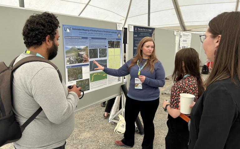 Graduate student Emily Graham shows her work about rusted rivers at the International Conference on Permafrost in Whitehorse, Yukon, on Monday, June 17, 2024. Photo by Rod Boyce