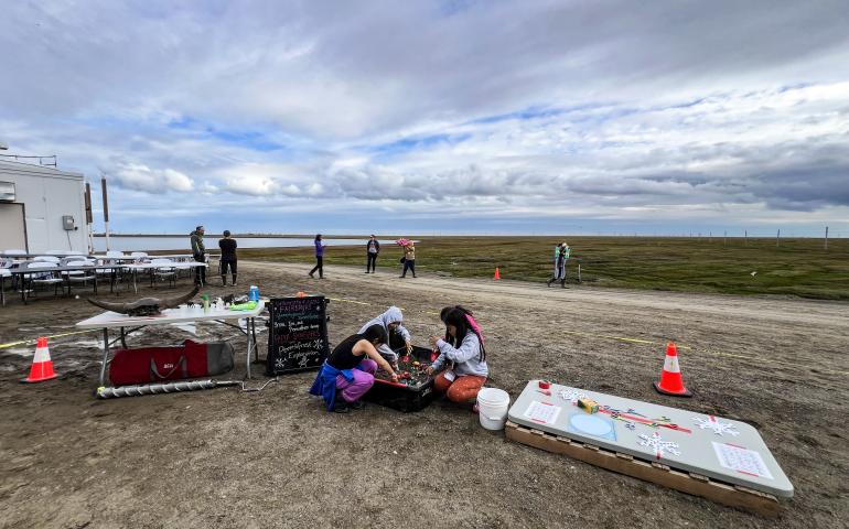 Elementary school students digging in the ‘Permafrost Exploration Sled’ while at the BARC Science & Culture Fair in August 2024. Photo by Serina Wesen