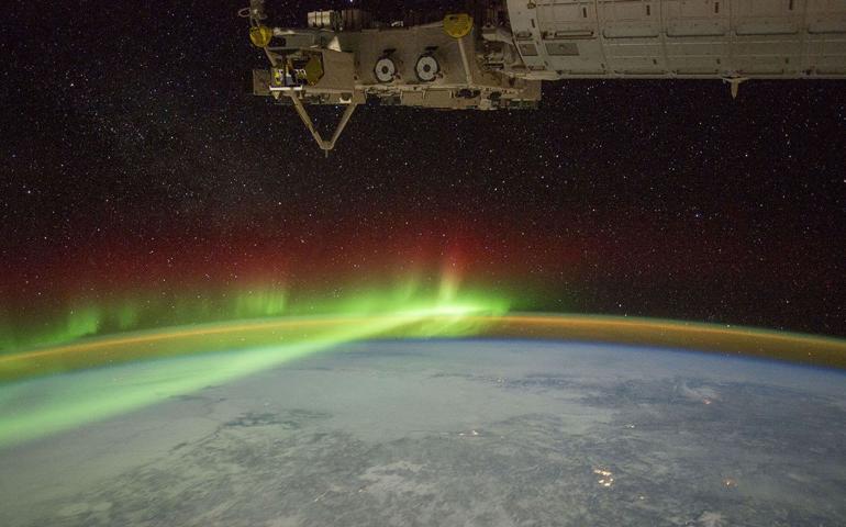The ionosphere and aurora wrap around Earth, as seen from the International Space Station. Photo courtesy of NASA