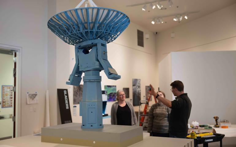 Roger Topp, right, and his team discuss the setup for a model of the antenna that sits atop the University of Alaska Fairbanks Elvey Building. UAF/GI photo by Bryan Whitten