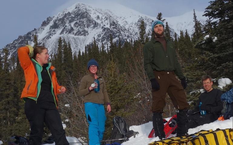 With Panorama Mountain in the background, from left, Lynn Kaluzienski, Elizabeth Berg, Cole Richards and Carl Tape take a break. Photo by Ned Rozell.